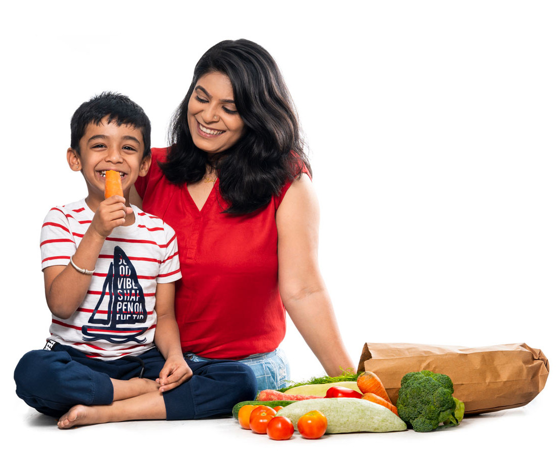 Mother and son with fresh vegetables