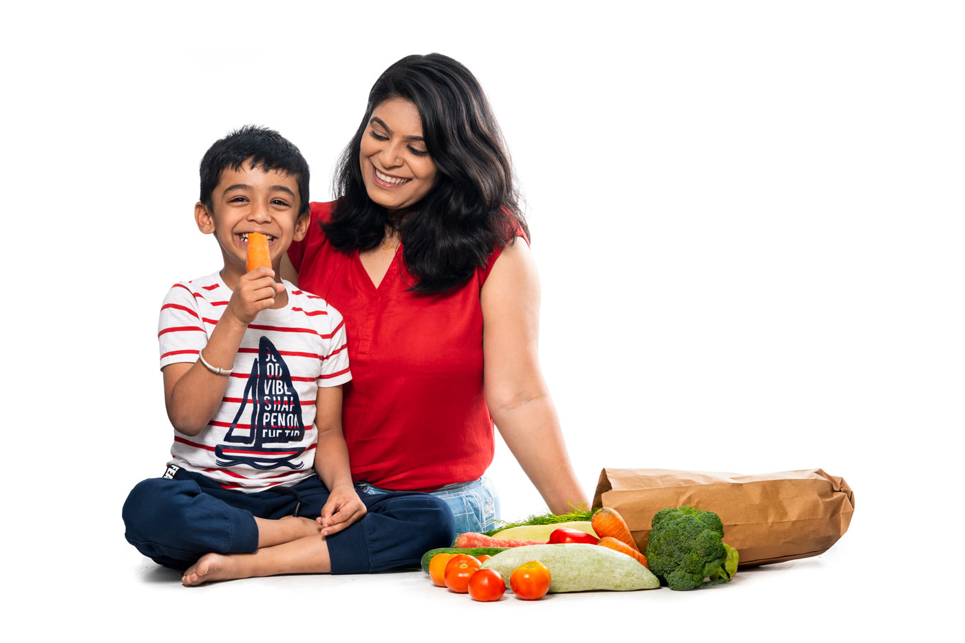 Mother and son with fresh vegetables